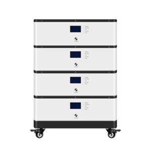 A vertical stack of four white residential energy storage battery modules resting on a black mobile base with caster wheels. Each module features a small digital display screen on the front panel.