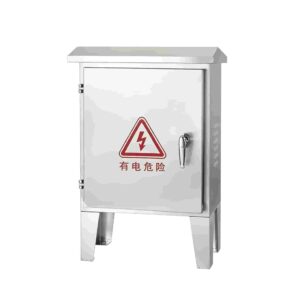 Floor-standing stainless steel electrical enclosure with short mounting legs on a white background, featuring a protective sloped roof and a red electrical danger warning label.